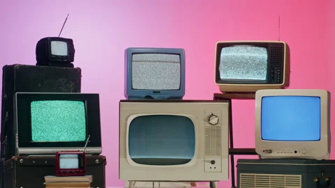 Old televisions with grey interference screen on pink red neon background Видео 169310489
