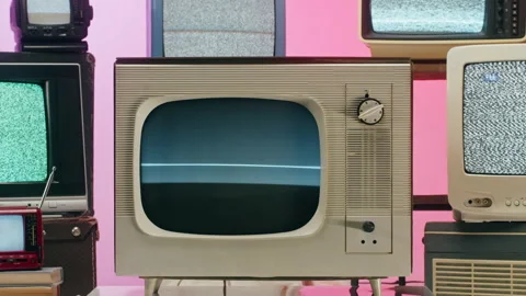 Old televisions with grey interference screen on pink red neon background Stock Footage 169373037