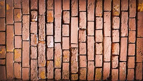Old texture Red dilapidated brick wall with cracks. Stock Photos