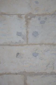 Old textured stone wall background in textured white Stock Photos