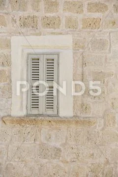 Old textured wall with window Stock Photos