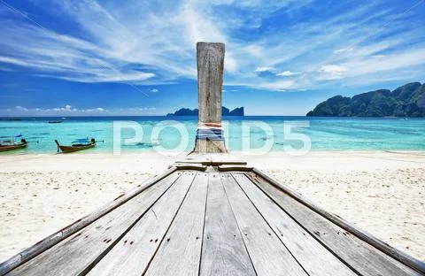 Old thai boat at the beach Stock Photos