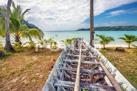 Old thai boat at the beach Stock Photos