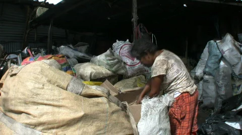 Old Thai Lady Goes Through The Garbage In The Slums Stock Footage