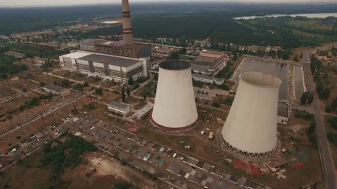 Old thermal power station creating pollution aerial Stock Footage 78767779