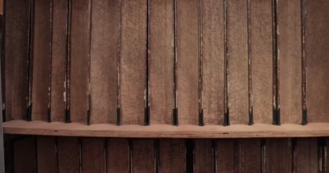 Old thick books in a library Stock Footage 308037616