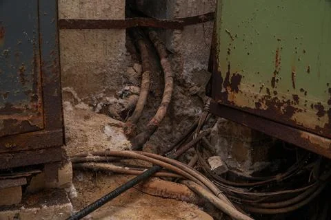 Old thick electrical cables in the dungeon or in basement Stock-Fotos