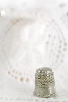 An old thimle and lace backdrop Stock Photos