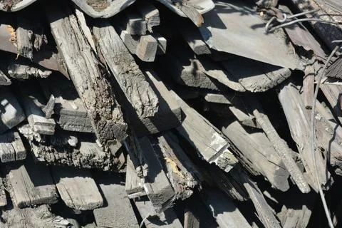 Old things and objects, old grey rotten boards of different sizes. Stock Photos