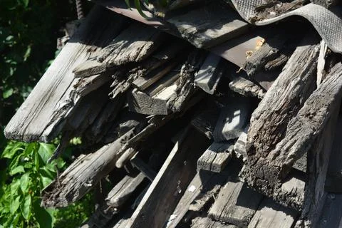 Old things and objects, old grey rotten boards of different sizes. Stock Photos
