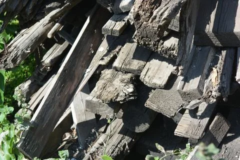 Old things and objects, old grey rotten boards of different sizes. Stock Photos