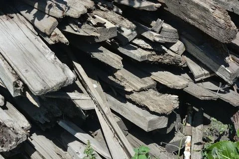 Old things and objects, old grey rotten boards of different sizes. Stock Photos