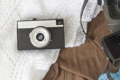 Old things folded in a retro suitcase for travel. Stock Photos
