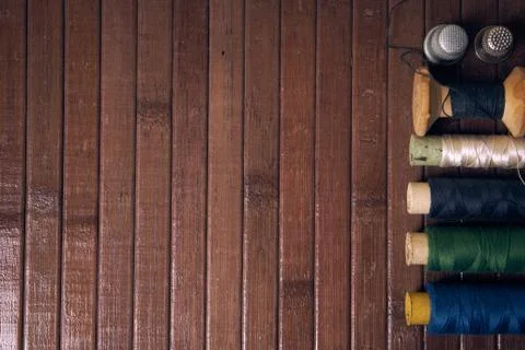 Old thread on wooden background Stock Photos