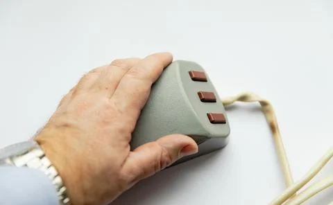 The old three-button mouse manipulator. Stock Photos