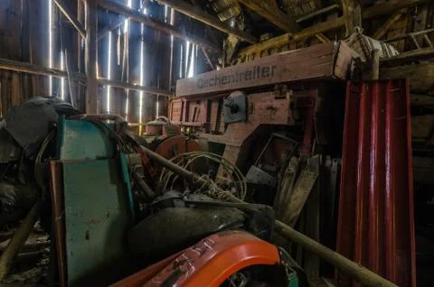 Old threshing machine in a barn Stock Photos