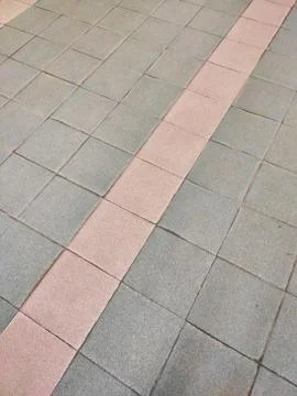 Old tiled floor of multicolored square tiles Stock Photos