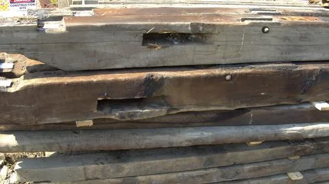 Old Timber Frame Lumber Being Carefully Laid and Stored for Restoration Stock Photos
