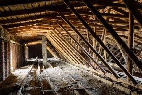 Old timbered dirty loft inside Stock Photos