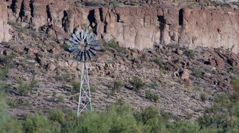An old time ranch windmill in a canyon Stock Footage 69172510