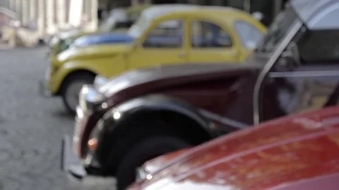Old timer 3 citroen 2cv parked in different color Stock Footage 84297841