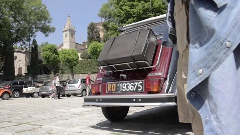 Old timer citroen 2cv rear view in car park near castle Stock Footage 84298543