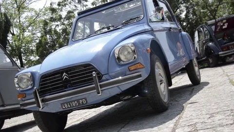 Old timer citroen 50's blue 2 cv front Stock Footage 84298589