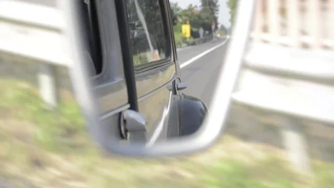 Old timer citroen rear mirror view driving around Stock Footage 84297794