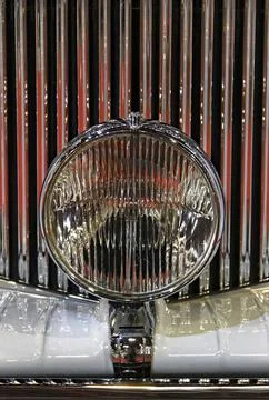 Old-timer shiny grille and close-up spotlight Stock Photos