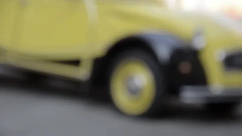 Old timer yellow citroen 2cv parking Stock Footage 84298110