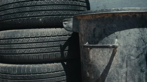 Old Tires And Garbage Can Stock Footage 248524830