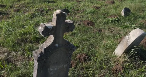 An old tombstone in an abandoned cemetery, 4k Stock Footage
