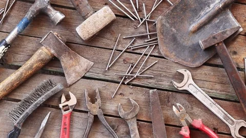 Old tool on a wooden plank surface, top view Stock Footage 282201514