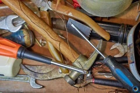 Old tools, hammer, screwdrivers, wrenches, wire wooden background Stock Photos