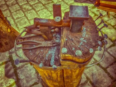 Old tools for handwork and a small anvil . Stock Photos