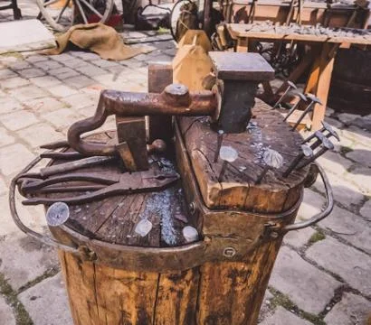 Old tools for handwork and a small anvil . Stock Photos