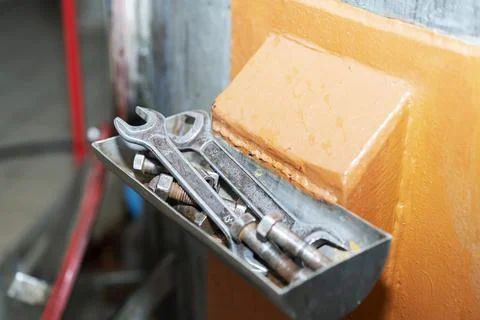 Old tools for men's work. Hammer and wrenches. Hang neatly in the box. Working Stock Photos