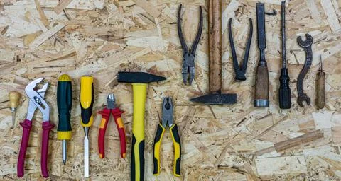 Old tools opposite modern tools. Concept: equipment upgrade. Stock Photos
