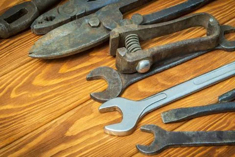 Old tools stacked before work on vintage wood background Stock Photos