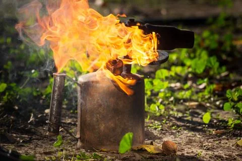 Old torch with a flame Stock Photos