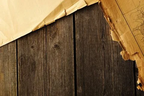 Old torn paper and map on the background Old torn paper and map on wood pl... Stock Photos