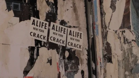 Old torn poster paper scraps texture on street wall Stock Footage 106535775