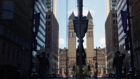 Old Toronto City Hall Clock Tower With Modern Skyline During Forward Camera Move Stockbeeldmateriaal 339070144