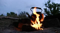 An Old Kettle Over The Camp Fire. The Kettle Boils Water For Tea Stock  Photo, Picture and Royalty Free Image. Image 84570904.