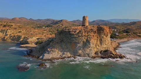 Old tower on a cliff by the sea in Cyprus during sunset Stock Footage 346017573