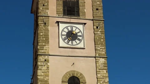 Old tower clock with roman numbers at catholic church Video stock 141143256