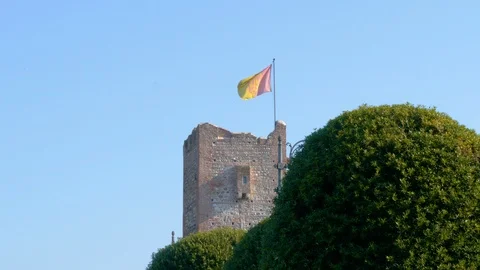 Old tower with a flag to a wind Stock Footage 86229583