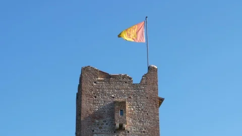 Old tower with a flag to a wind Stock Footage 86230681