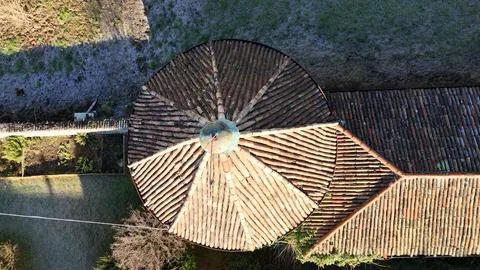 Old tower house in walled garden winter aerial view Stock Photos