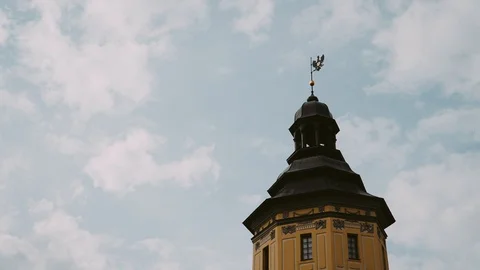 Old tower with vane against the sky with clouds moving. Stock Footage 118776991